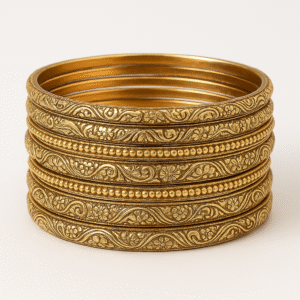 traditional gold toned metal bangle set with intricate design